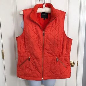 Quilted vest with zippered front and side pockets
